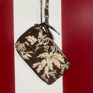 A Vera Bradley wristlet WITH stains pictured